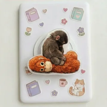 Team Punch Sleepy Macaque on Plushie Kindle Kawaii MagSafe Phone Grip